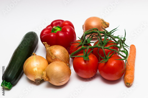 Morov  onion  zucchini  tomato  red bell pepper  on white background.