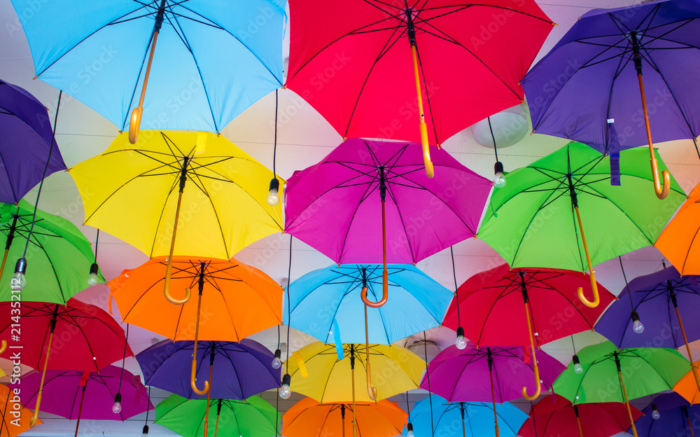 A lot of multicolored umbrellas at the street