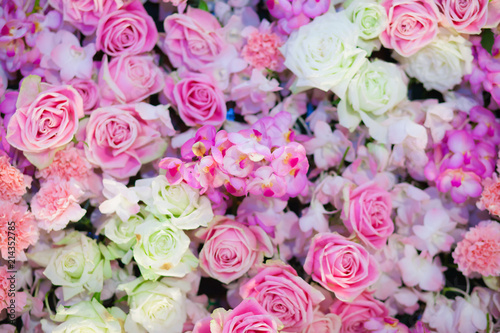 Beautiful artificial pink flowers for background. © alexzeer