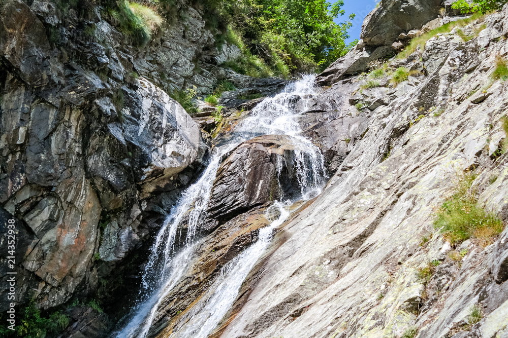 Waterfall in an alpine valley Waterfall in an alpine valley