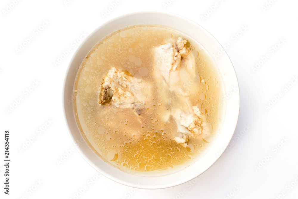 Bowl of pork bone soup with herbs isolated on white background Bowl of pork bone soup with herbs isolated on white background