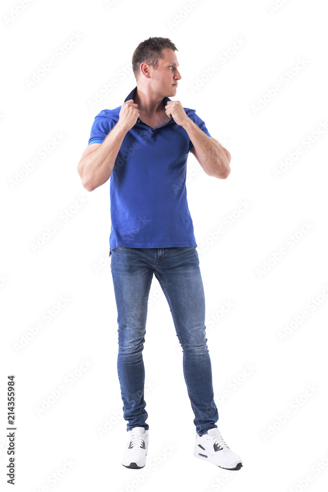 Cool handsome man in 30s fashion model holding collar posing and looking away. Full body isolated on white background. Cool handsome man in 30s fashion model holding collar posing and looking away. Full body isolated on white background.