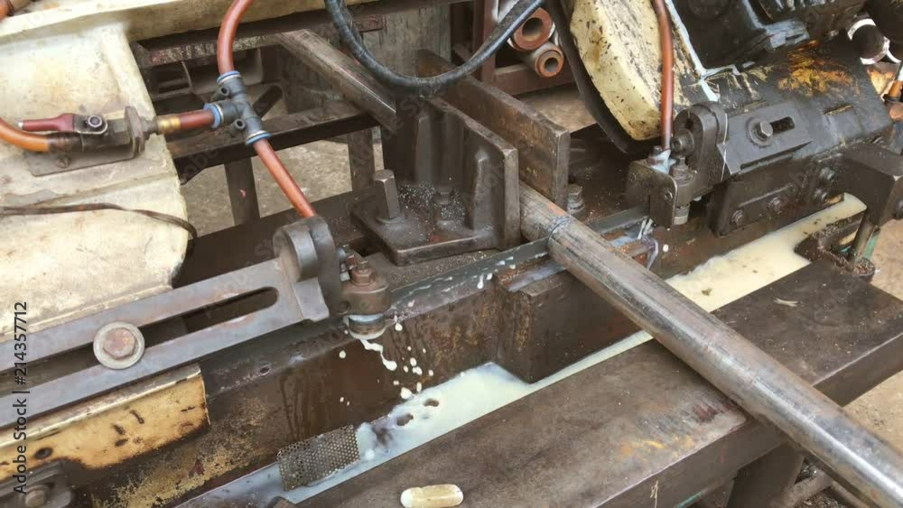Cutting a steel pipe with the electric saws in factories. Cutting a steel pipe with the electric saws in factories.