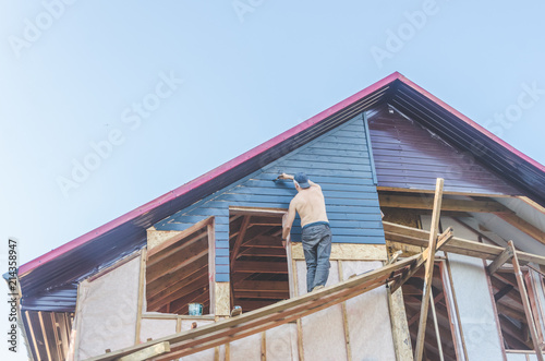 wooden house to paint the worker at height
