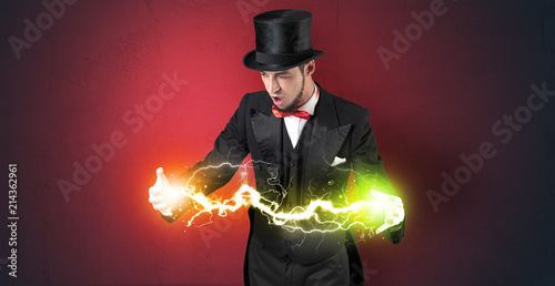 Magician sparkling super power between his two hands