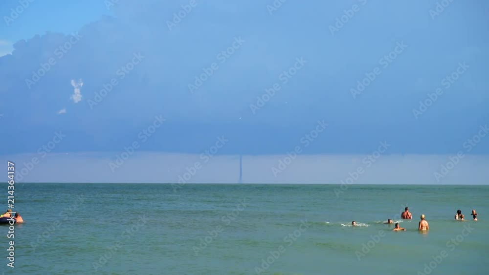 Tornado and lightnings in the sky over the sea. Tornado and lightnings in the sky over the sea.