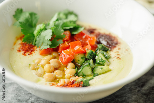 Hummus with vegetables, herbs, spices and cakes