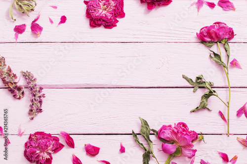 dried flowers on pink wooden background