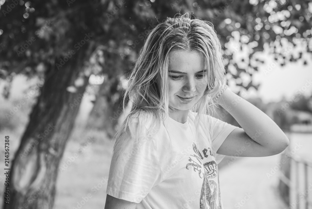 Portrait of a young student girl with blonde hair without makeup.Girl positive smiles. Teenage or student lifestyle Portrait of a young student girl with blonde hair without makeup.Girl positive smiles. Teenage or student lifestyle