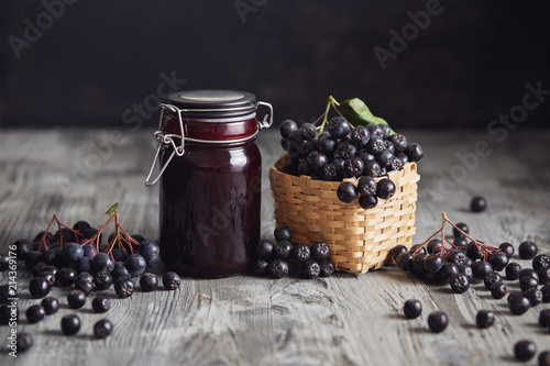 Aronia jam next to fresh berries