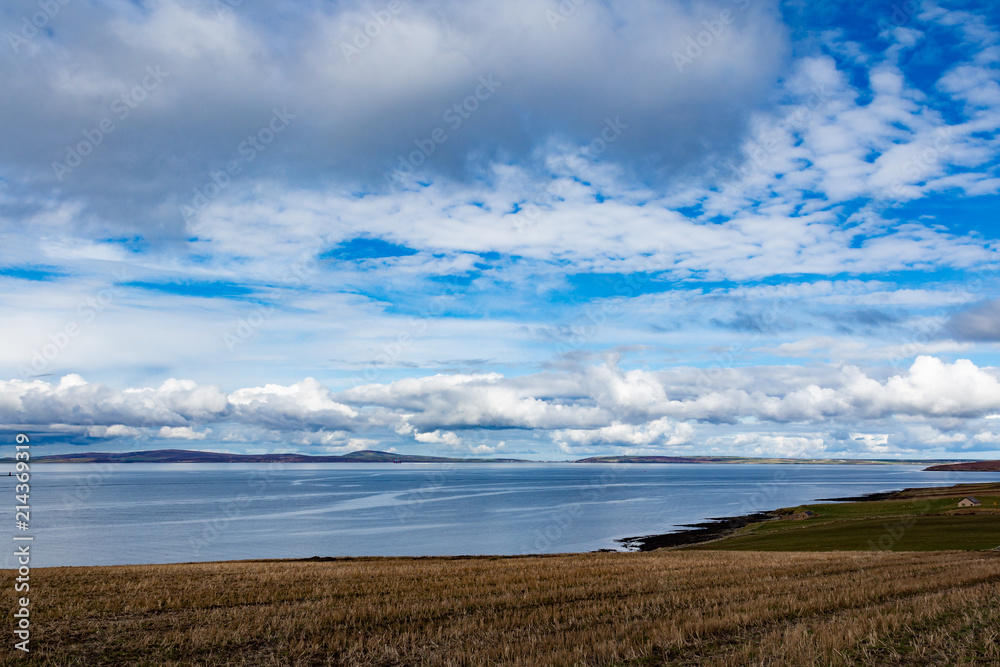 fields by orkney coast