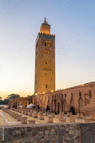Minaret of Koutoubia Mosque with Ruins of Old Mosque at sunrise in Marrakech, Morocco.