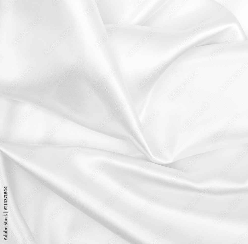 Smooth elegant white silk or satin luxury cloth texture as wedding background. Luxurious background design