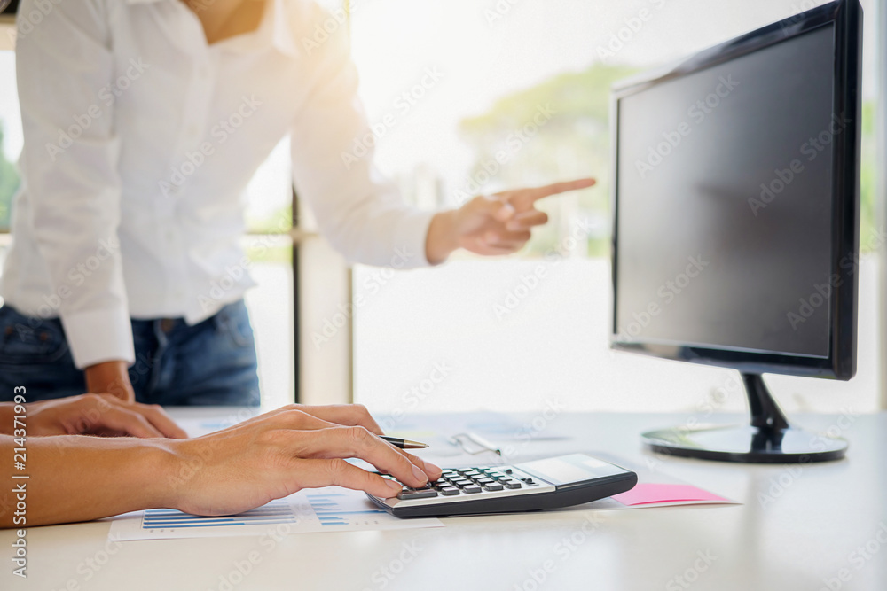Business adviser analyzing financial figures denoting the progress Internal Revenue Service checking document. Audit concept Business adviser analyzing financial figures denoting the progress Internal Revenue Service checking document. Audit concept