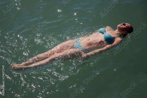 girl lying on the water