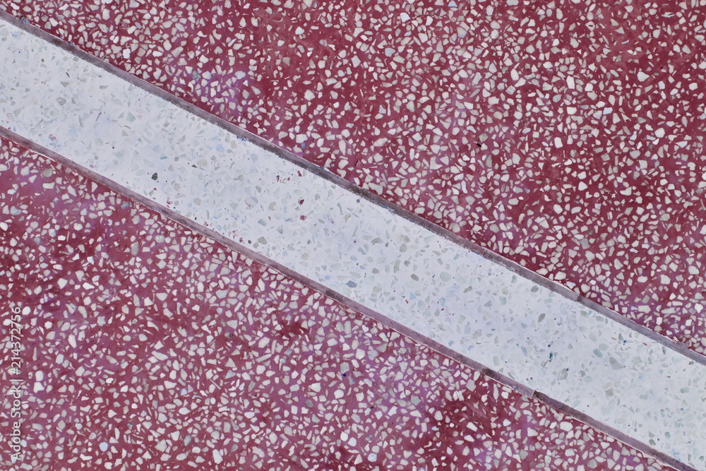 Fototapeta premium Pattern of artificial marble tabletop for background. Red surface with white stripes