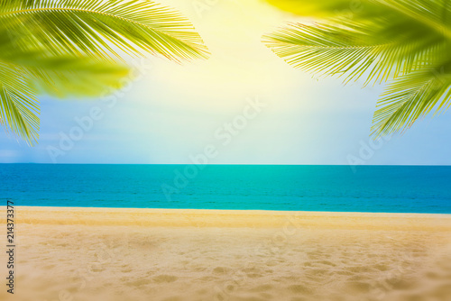 Fototapeta Naklejka Na Ścianę i Meble -  Sandy beach with coconut trees and bokeh beach tropical background, summer vacation and travel ideas, relaxation