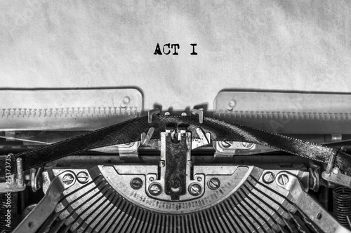 ACT I, typed text on a vintage typewriter, screenplay title heading. On old paper with ink. writer's idea
