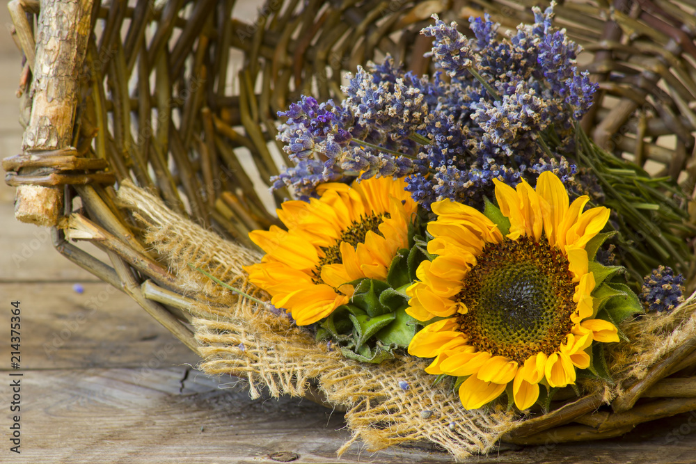 Fototapeta premium sunflowers and lavender in a basket