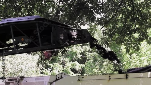 road construction by my house. This is a short clip of road dirt being dumped in the truck photo