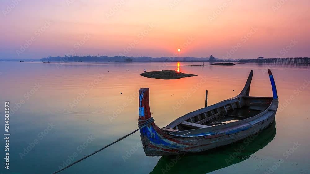 4K Time lapse of boats at U Bein Bridge in the dawn at Amarapura where is a part of Mandalay, Myanmar. 4K Time lapse of boats at U Bein Bridge in the dawn at Amarapura where is a part of Mandalay, Myanmar.