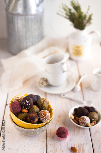 Assorted raw vegan sweet candy gluten-free balls with carob   coconut and poppy seeds almonds nuts