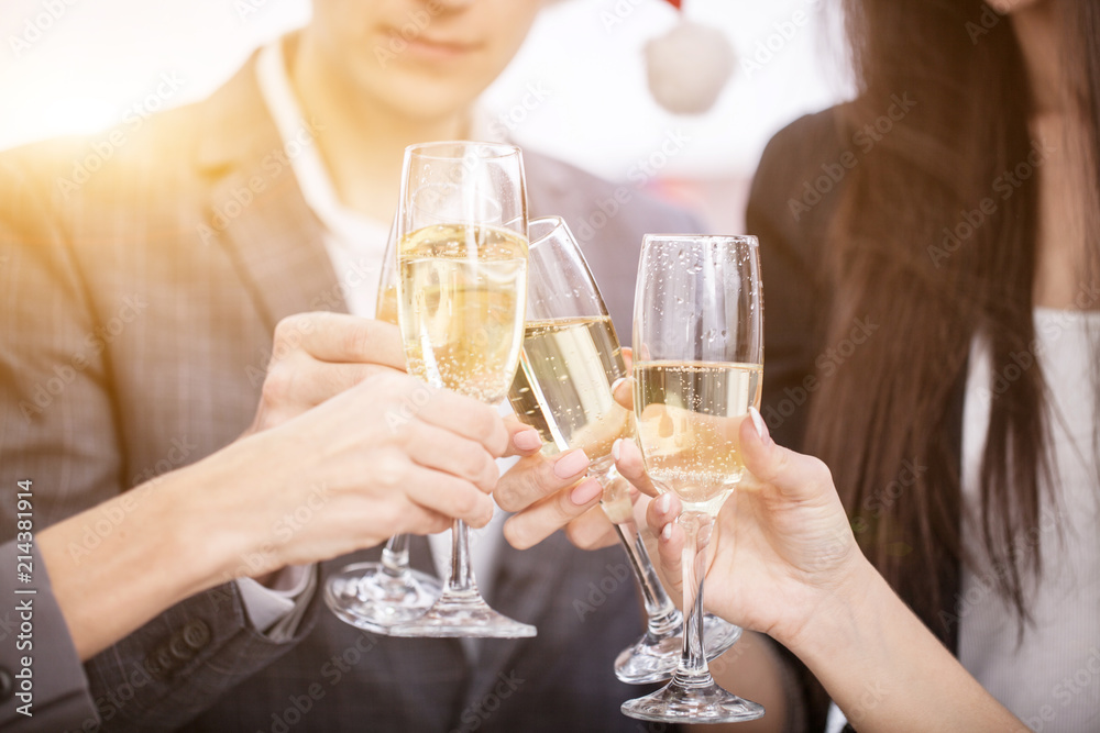 Close up of business team toasting with Champagne Close up of business team toasting with Champagne