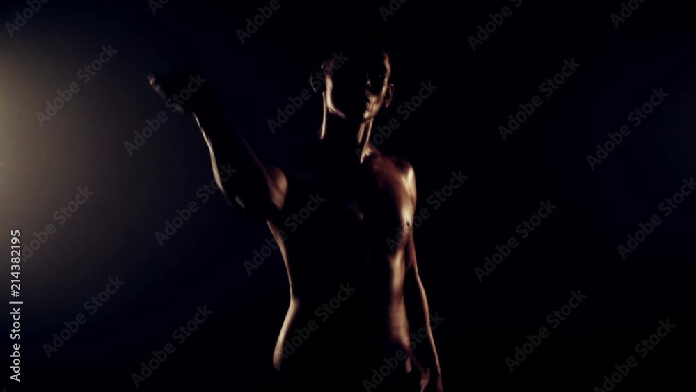 Sexy man dancing on black background Sexy man dancing on black background
