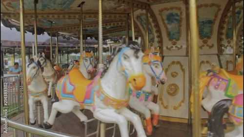 A Horse carousel spinning in daytime photo