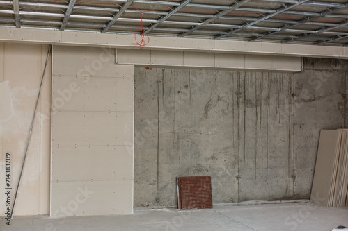 Wallpaper Mural Drywall installation work in progress by construction workers at the construction site. It is the easiest and cheapest way to do partition for interior wall Torontodigital.ca