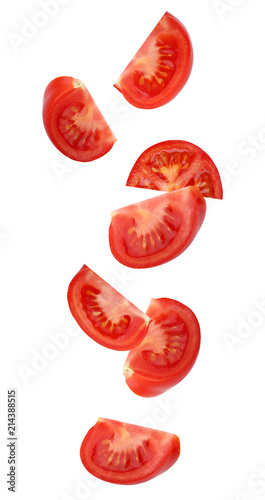 Falling (flying) tomato, isolated on white background.