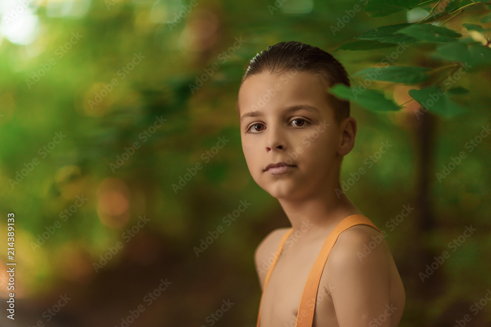 photo with a portrait of a boy outdoors photo with a portrait of a boy outdoors