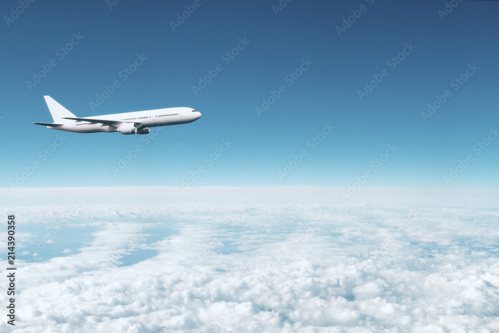 Naklejka premium lecący samolot nad chmurami