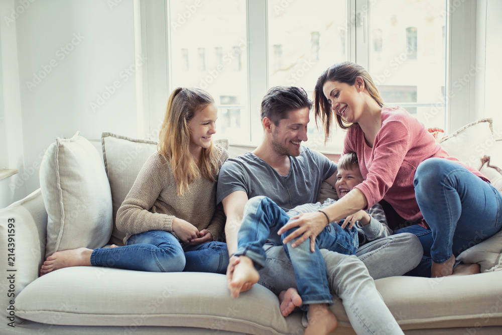 modern happy familie at home on couch modern happy familie at home on couch