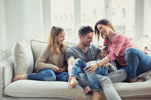 modern happy familie at home on couch
