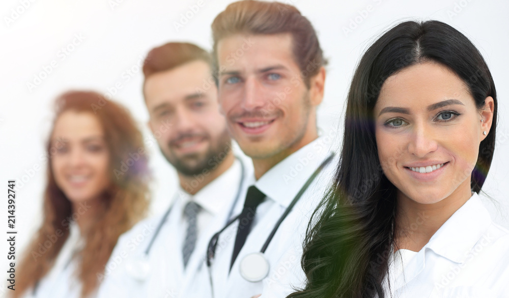 woman doctor on the background of colleagues woman doctor on the background of colleagues
