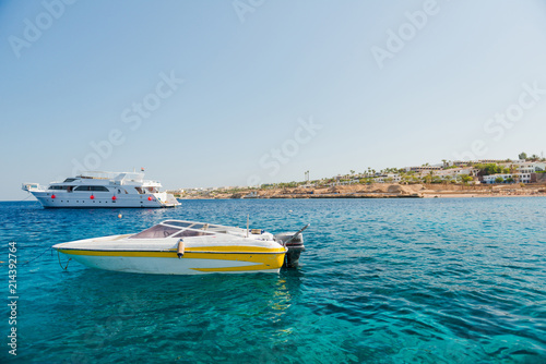 motor boat and yacht at sea coast background © arts