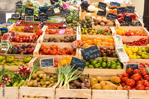 Fototapeta Naklejka Na Ścianę i Meble -  Vegetables and fruits in wooden crates at market