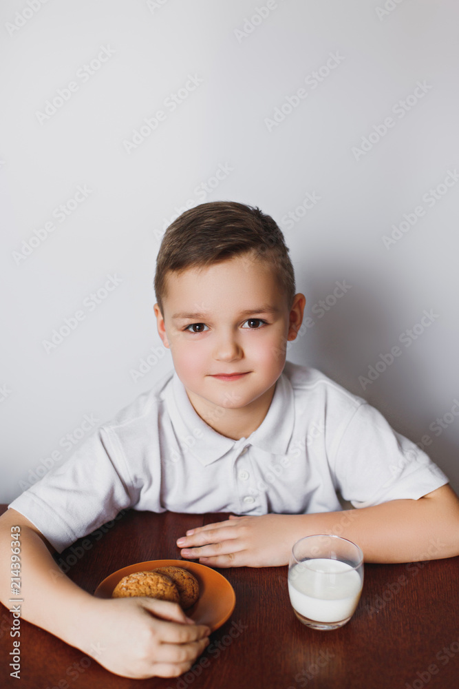 Cookies, milk and a boy in the kitchen. Cookies, milk and a boy in the kitchen.