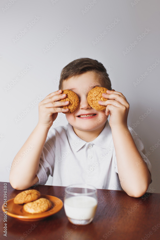 Cookies, milk and a boy in the kitchen. Cookies, milk and a boy in the kitchen.