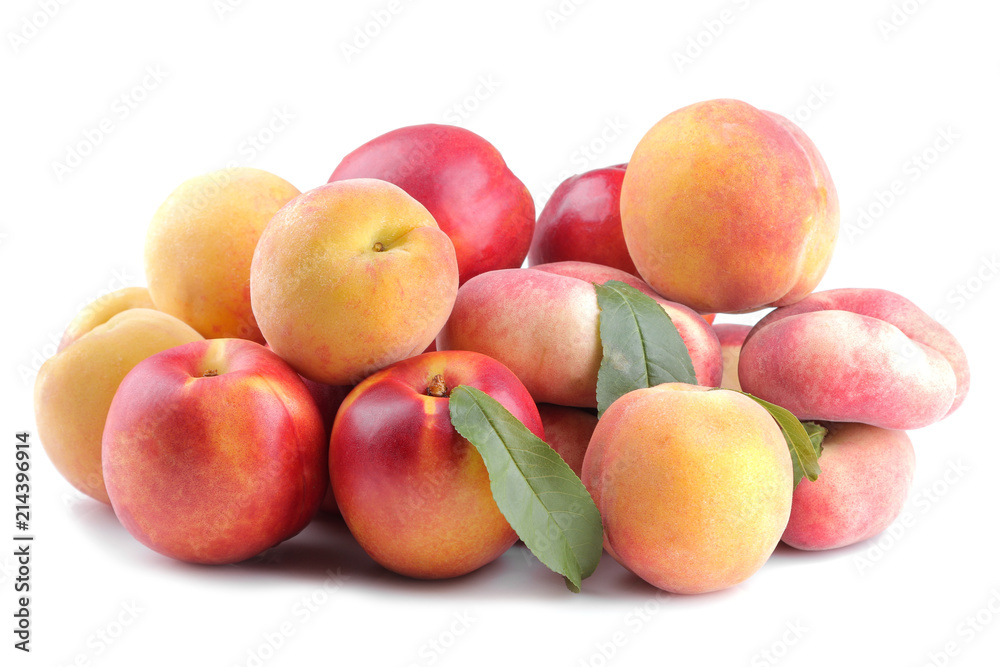 Different varieties of large fresh peaches on a white isolated background