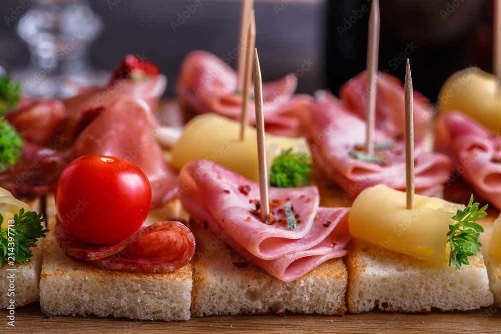 Pintxos, tapas, spanish canapes party finger food background.