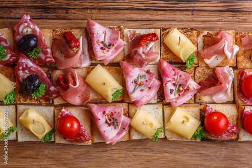 фотографія Pintxos, tapas, spanish canapes party finger food background.