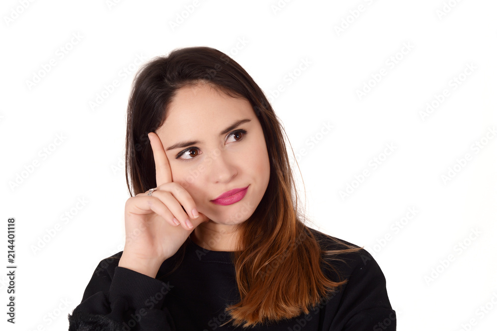 Young thoughtful woman with hand on her chin Young thoughtful woman with hand on her chin
