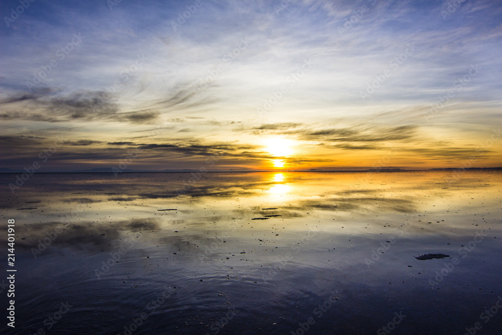 Uyuni reflections are one of the most amazing things that a photographer can see. Here we can see how the sunrise over an infinite horizon with the Uyuni salt flats making a wonderful mirror. 