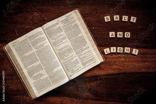 Flat lay of an open Bible and text