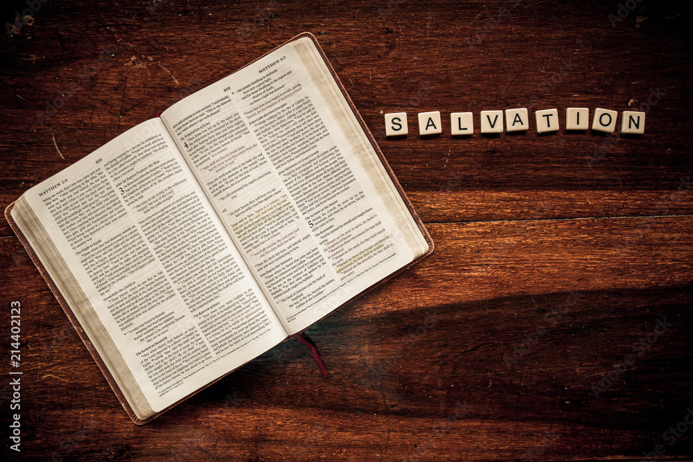 Fototapeta premium Flat lay of an open Bible and text