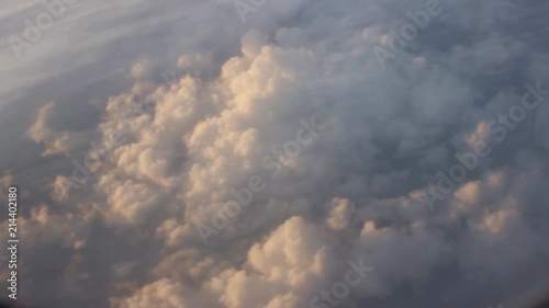Flight over white clouds in the evening