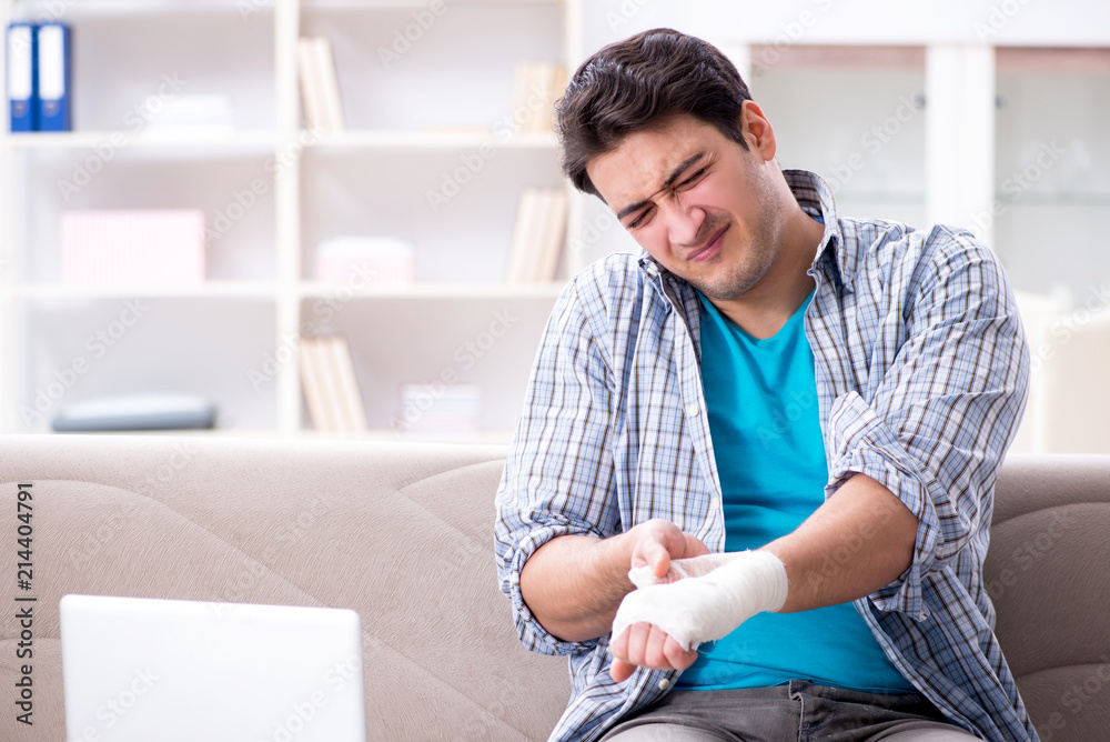 Young student man with injury at home Young student man with injury at home