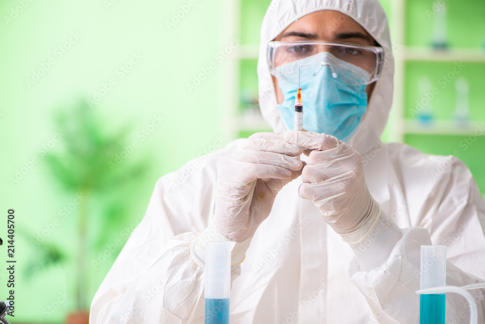 Chemist working in the lab on new experiment Chemist working in the lab on new experiment